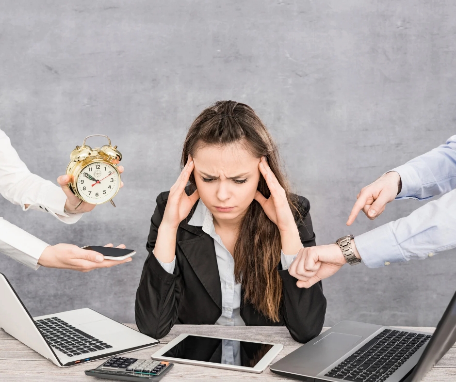 Digital Marketing Mistakes - Overwhelmed entrepreneur trying to manage too many platforms at once